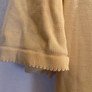 Pale yellow silk top.